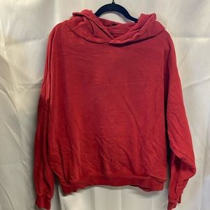 All Saints Red hooded sweatshirt with side pockets.